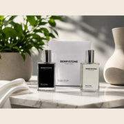 Berrystone black and white label perfume bottles in natural daylight